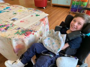 Photo of child smiling during a March Break recreation program craft activity